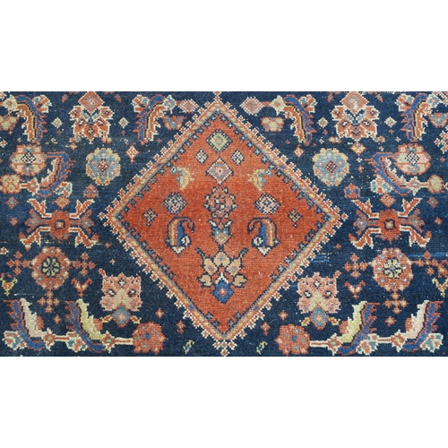 97 - A BLUE GROUND CAUCASIAN RUG