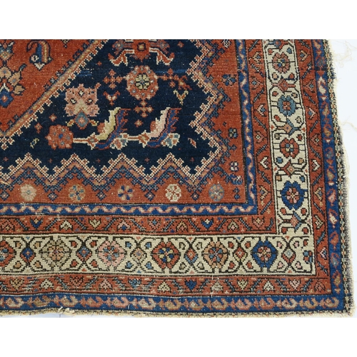 97 - A BLUE GROUND CAUCASIAN RUG