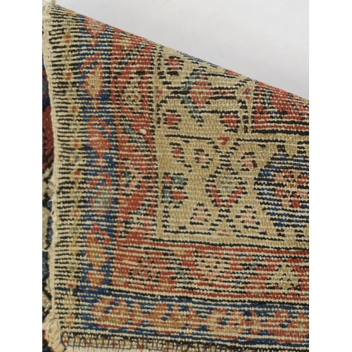 97 - A BLUE GROUND CAUCASIAN RUG