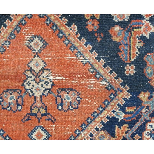 97 - A BLUE GROUND CAUCASIAN RUG