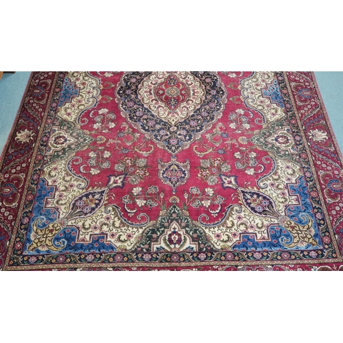 99 - A RED GROUND VINTAGE PERSIAN TABRIZ RUG