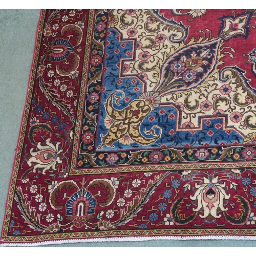 99 - A RED GROUND VINTAGE PERSIAN TABRIZ RUG