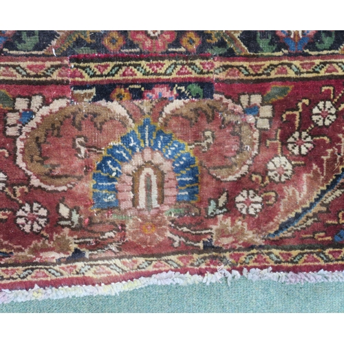 99 - A RED GROUND VINTAGE PERSIAN TABRIZ RUG