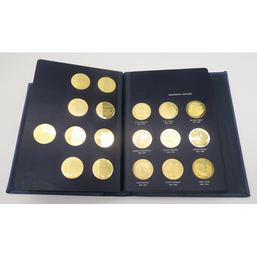 532 - A Medallic History of Medicine limited edition gold on silver coin set together with an Isle of Man ... 