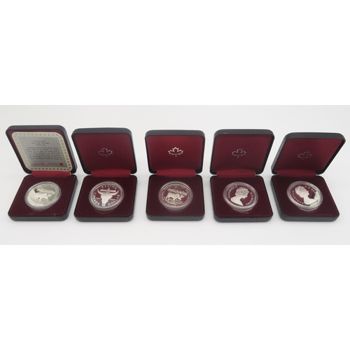 543 - A lot British and American commemorative coins with cased examples together with various bank notes ... 