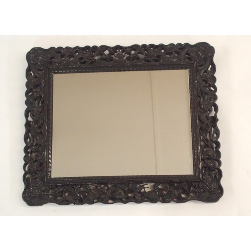 194 - A CHINESE HARDWOOD WALL MIRROR