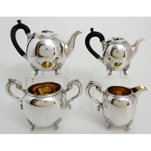 245 - A FOUR PIECE SILVER TEA SERVICE