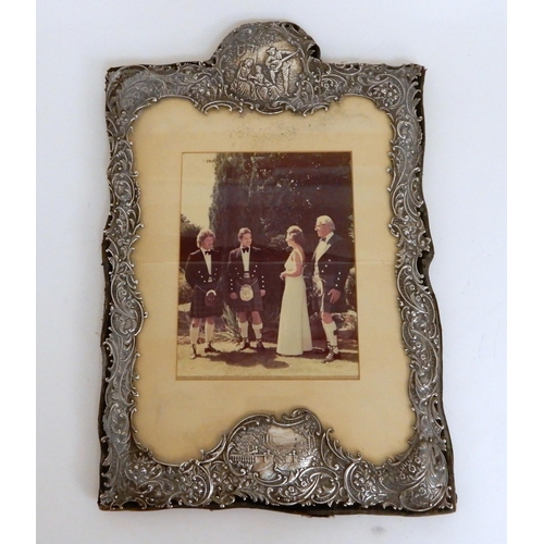 246 - A SILVER MOUNTED PHOTO FRAME