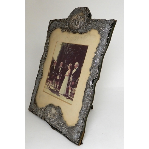 246 - A SILVER MOUNTED PHOTO FRAME