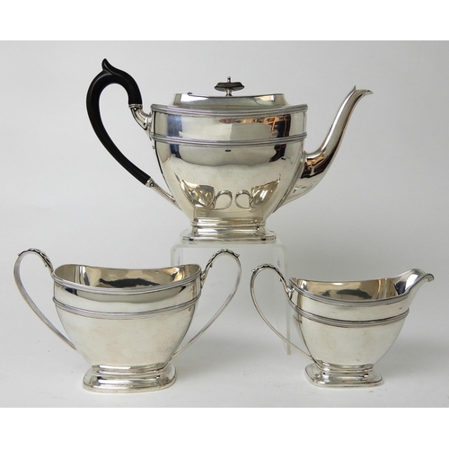 253 - A THREE PIECE SILVER TEA SERVICE