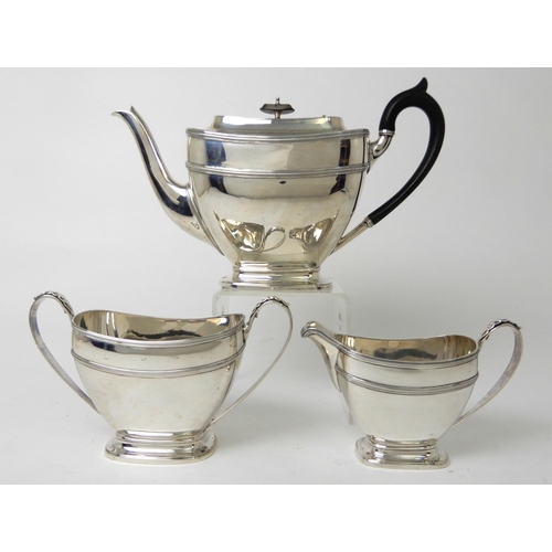 253 - A THREE PIECE SILVER TEA SERVICE