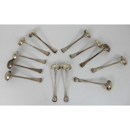 293 - A SET OF TWELVE SILVER SAUCE LADLES