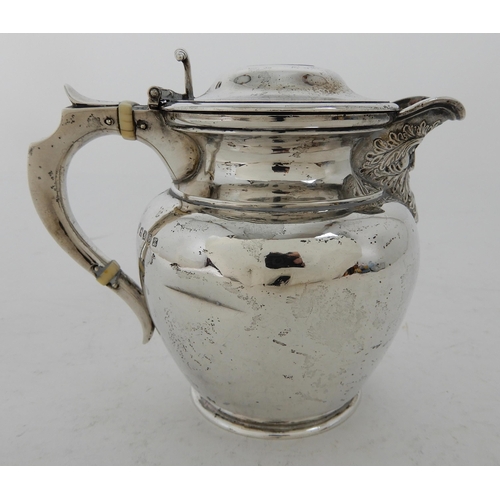 303 - AN EDWARDIAN SILVER LIDDED ALE JUG