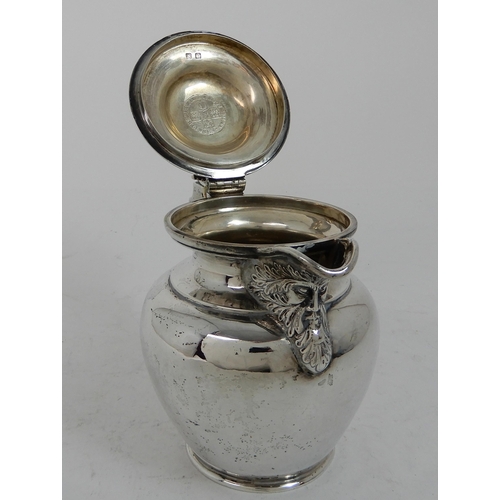 303 - AN EDWARDIAN SILVER LIDDED ALE JUG