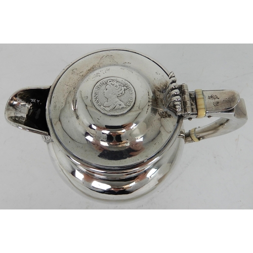 303 - AN EDWARDIAN SILVER LIDDED ALE JUG