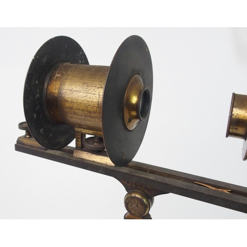 371 - A VINTAGE FRENCH BRASS PROJECTING MICROSCOPE