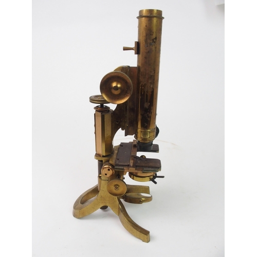 372 - A VICTORIAN BRASS MICROSCOPE BY J SWIFT AND SON