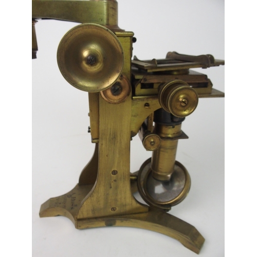 377 - A VICTORIAN BRASS MICROSCOPE BY A. ROSS  LONDON