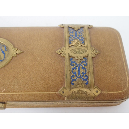 395 - A LEATHER GILT-METAL AND ENAMEL GLOVE BOX