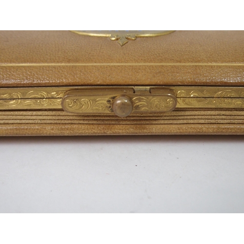 395 - A LEATHER GILT-METAL AND ENAMEL GLOVE BOX