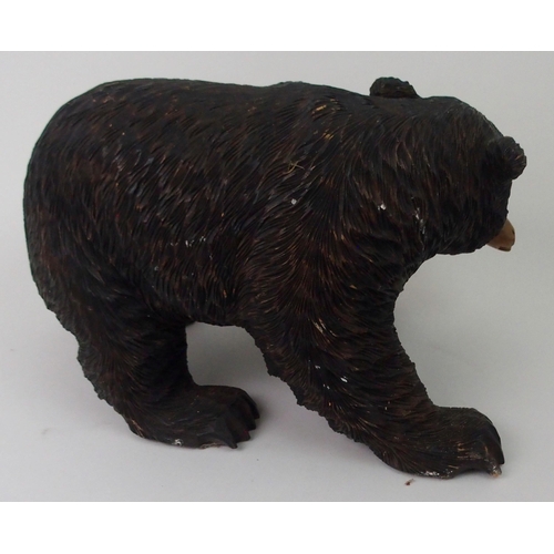 399 - A BLACK FOREST STYLE CARVED BEAR WITH SALMON