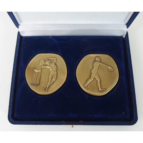 420 - A CASED SET OF 2004 OLYMPIC SPECIAL ISSUE BRONZE MEDALLIONS