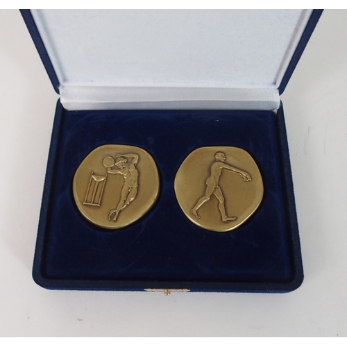 421 - A CASED SET OF 2004 OLYMPIC SPECIAL ISSUE BRONZE MEDALLIONS