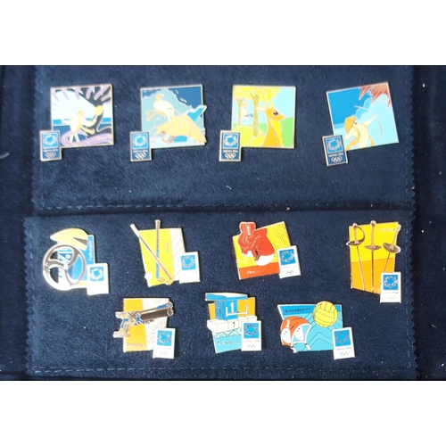 423 - A LARGE COLLECTION OF 2004 OLYMPIC ENAMEL LAPEL BADGES