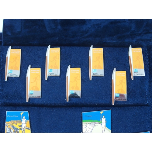 423 - A LARGE COLLECTION OF 2004 OLYMPIC ENAMEL LAPEL BADGES