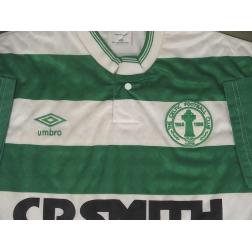 437 - A GREEN AND WHITE CELTIC SHORT-SLEEVED SHIRT