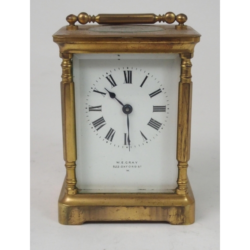 516 - A FRENCH BRASS AND GLASS CARRIAGE CLOCK