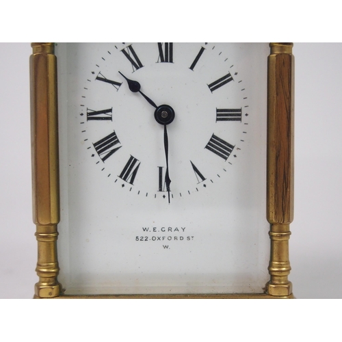 516 - A FRENCH BRASS AND GLASS CARRIAGE CLOCK