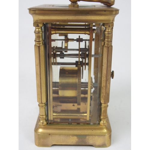 516 - A FRENCH BRASS AND GLASS CARRIAGE CLOCK