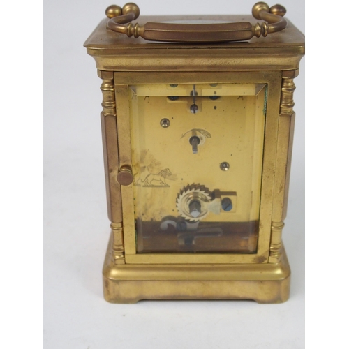 516 - A FRENCH BRASS AND GLASS CARRIAGE CLOCK