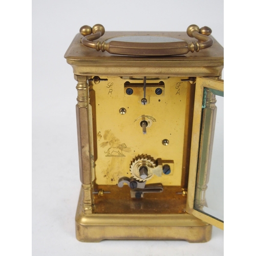 516 - A FRENCH BRASS AND GLASS CARRIAGE CLOCK