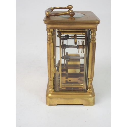 516 - A FRENCH BRASS AND GLASS CARRIAGE CLOCK