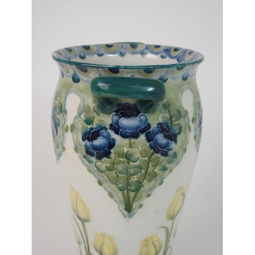 517 - A WILLIAM MOORCROFT FOR JAMES MACINTYRE 'TULIPS AND ROSE' PATTERN VASE