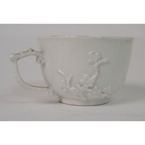 524 - A MEISSEN WHITE GLAZED CUP AND SAUCER