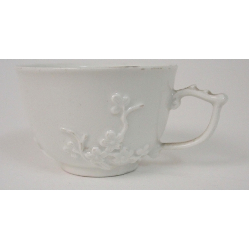 524 - A MEISSEN WHITE GLAZED CUP AND SAUCER