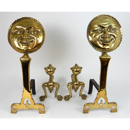 545 - A PAIR OF POLISHED BRASS SMILING MOON FACE FIRE DOGS