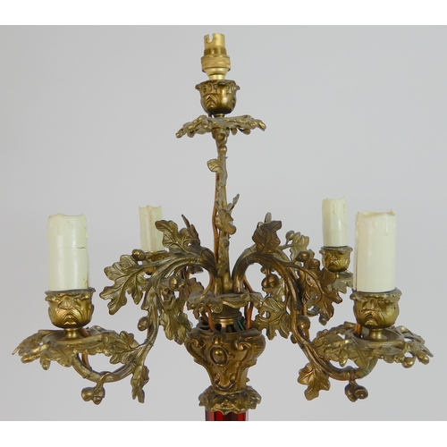 557 - AN ANTIQUE CANDELABRA TABLE LAMP