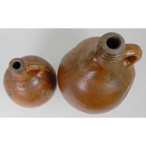 562 - A LATE 18TH/EARLY 19TH CENTURY STONEWARE BELLARMINE JUG