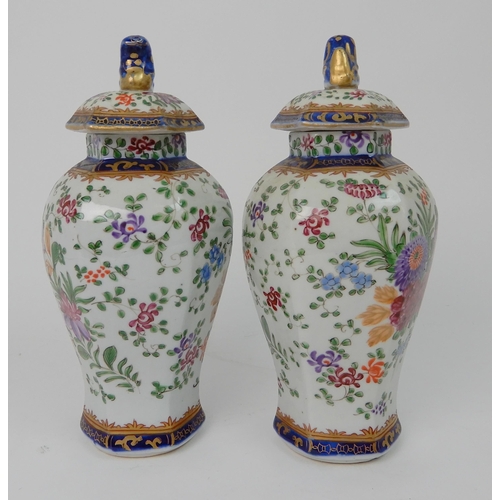 570 - A PAIR OF SAMSON JARS AND COVERS