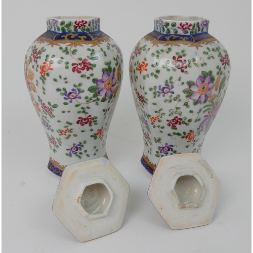 570 - A PAIR OF SAMSON JARS AND COVERS