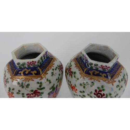 570 - A PAIR OF SAMSON JARS AND COVERS