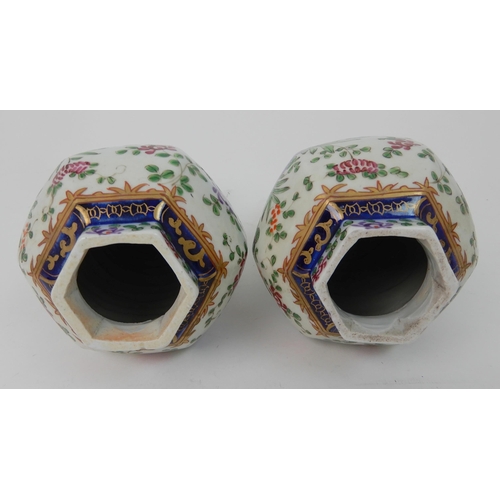 570 - A PAIR OF SAMSON JARS AND COVERS