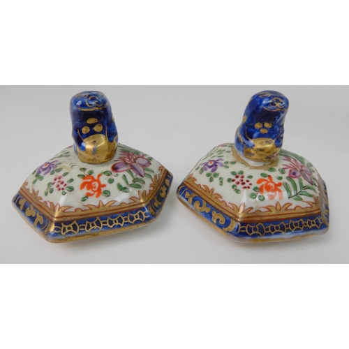 570 - A PAIR OF SAMSON JARS AND COVERS