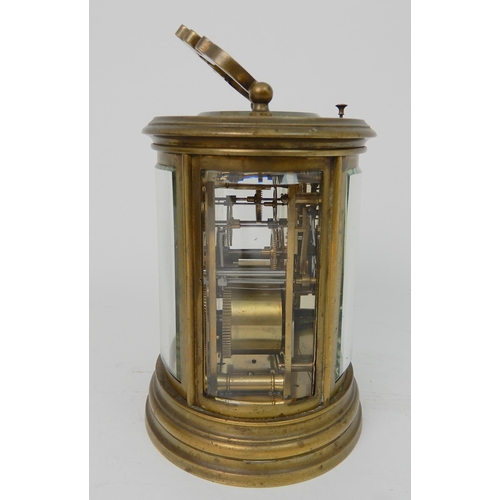 572 - A 19TH CENTURY LARGE OVAL BRASS REPEATING CARRIAGE CLOCK