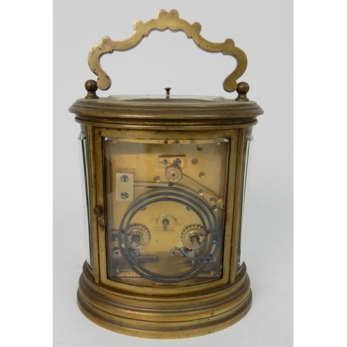 572 - A 19TH CENTURY LARGE OVAL BRASS REPEATING CARRIAGE CLOCK