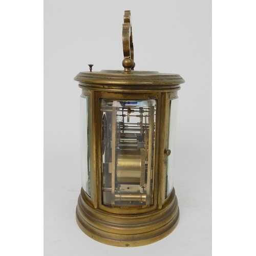 572 - A 19TH CENTURY LARGE OVAL BRASS REPEATING CARRIAGE CLOCK